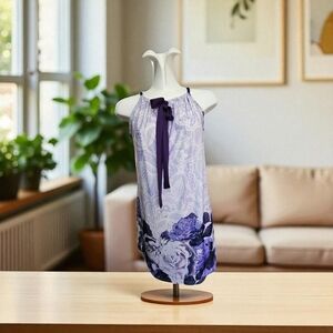 Pretty Tunic Length Top With Adjustable Neck Thst Ties In A Bow.